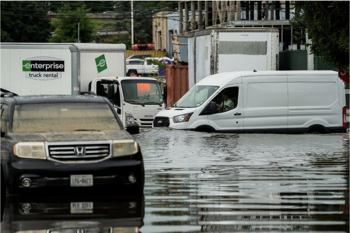 cars on flood road in New York